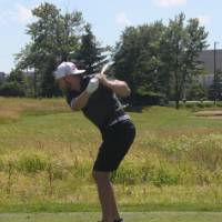 guy hits golf ball (drive)